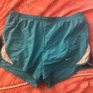 Used but it’s great condition. Blue, grey and white Nike workout shorts